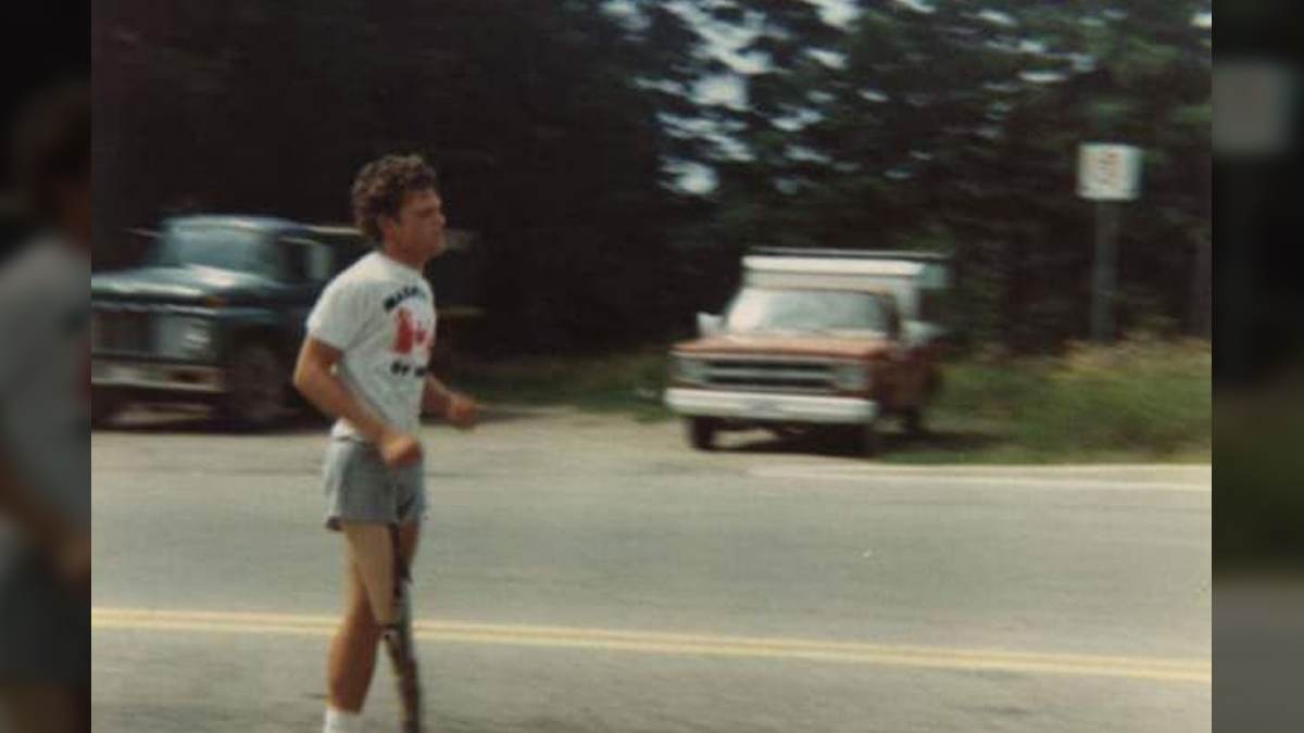 A determined Terry Fox grimaces as he runs past The Blue Moon in Petersburg on Sunday, July 20, 1980. Photo Shelley Vollmer.
